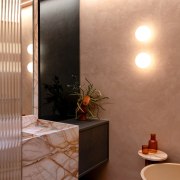 Globe-shaped sconces contribute to the ethereal ambience that 