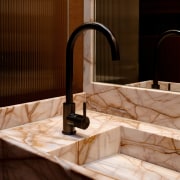 Gunmetal-finished mixer contrasts and complements the pink, beautifully 