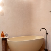 The bath tones in with the bathroom's hero 