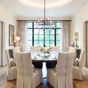 A feature ceiling and contemporary chandelier set off 