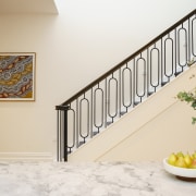 The bespoke staircase, positioned centrally, features a sleek 