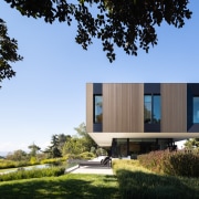 The rainscreen façade system in anodised bronze aluminium 