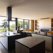 The open living level integrates living, dining, kitchen, 