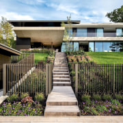 A boardwalk and staircase descend to a refurbished 