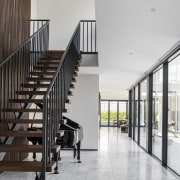 Stairs, formal living room straight ahead and side 