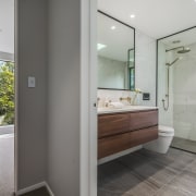 Creating a wet room with glass shower divider 