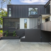 Soft grey vertical cedar contrasts with a light 