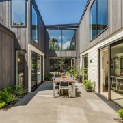 The U-shaped design semi-encloses a sheltered outdoor space 