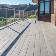 Central Otago Home Features A Beautiful TimberTech Composite composite material, deck, floor, handrail, outdoor structure, real estate, walkway, wood, gray
