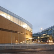 The artistic Helsinki library is a giant magnet architecture, building, city, commercial building, corporate headquarters, facade, headquarters, metropolitan area, mixed-use, sky, teal