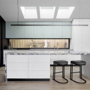 The kitchen is flooded with natural light - 