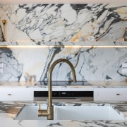 Marble shelving all but disappears into the regal 