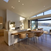 Strategically placed skylights and clerestory windows introduce both 