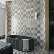 The brass-white Carrara marble feature wall is carried 