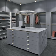 Dressing room with eye-catching pendant and waterfall benchtop 