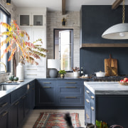 Soapstone countertops keep the palette clean, with a 