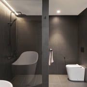 The glass panelling between the shower and bath space 