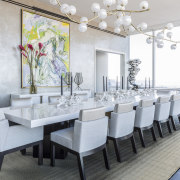 In the dining room, the expansive lacquered table 