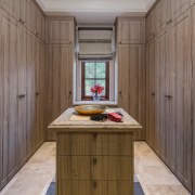 Dressing room with walls of built-in storage. 