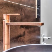 Copper tapware was chosen to complement the tilework. 