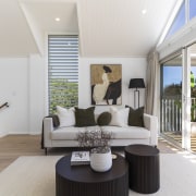 Upstairs living space boasting relaxed indoor-outdoor flow. 