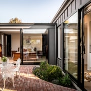 The central courtyard improves cross-flow ventilation and lets 