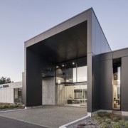 The office building is clad in concrete panel 