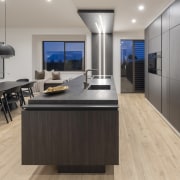 Both the island and rear wall cabinetry combine 