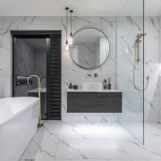 A large shower zone and freestanding bath make 