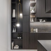 A brass pendant shows off the scullery cabinetry 