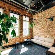  The retreat space with large plants and exposed 