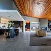 Living, kitchen with defining intimate ceiling, and dramatic 