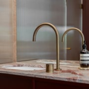 The refined basin spout is in Antique Brass. 