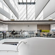 Giant panels hang midair in the atrium, providing 