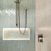 On the shower wall, the Tribeca Seaglass Mint 