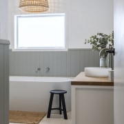 The vanity, on legs, has a furniture-like appeal. 