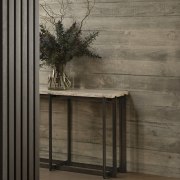 Concrete exterior cladding is continued indoors. 