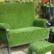 A chair furnished with TigerTurf for added backyard, chair, furniture, garden, grass, hedge, landscaping, lawn, outdoor furniture, outdoor structure, plant, shrub, tree, yard, green