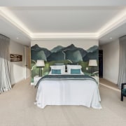 Feature wall paper in the master bedroom reinforces 