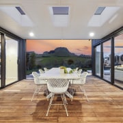 Generous al fresco dining tucked between the sheltering 