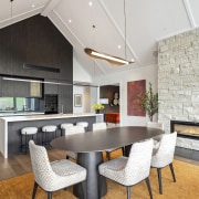 KItchen and dining with feature fireplace wall. 