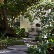 Pavers leading to an al fresco seating area 