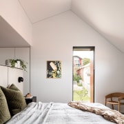 The master suite's steep gabled roofline translates into 