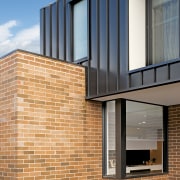Existing bricks running one way, standing seam metal apartment, architecture, blue, brick, brickwork, building, daylighting, daytime, facade, glass, home, house, line, material property, property, real estate, residential area, siding, sky, wall, window