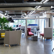 Zenith's new space features polished concrete floors alongside architecture, building, ceiling, floor, flooring, furniture, house, interior design, loft, office, property, real estate, restaurant, room, table, gray