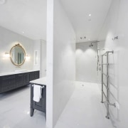 ​​​​​​​This shower area is L-shaped, with the shower architecture, bathroom, design, floor, flooring, tile, wall, white, gray, rain showerhead, Ingrid Geldof, vanity wall