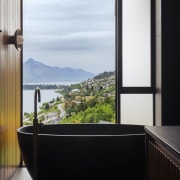 Soaking in the scenery from the sculptural tub. 