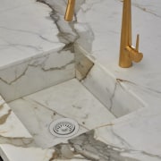 Kitchen stone benchtop, gold tap and built-in sink 