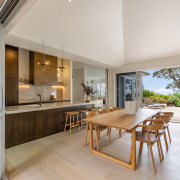 The kitchen and dining areas enjoy open indoor-outdoor 