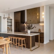 Breakfast stools and dinner seating enjoy tonal connection. 